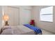 Comfortable bedroom with double bed and ample closet space at 5521 Hogan Ln, Winter Haven, FL 33884