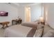 Bedroom with two twin beds, a desk, and a TV at 5521 Hogan Ln, Winter Haven, FL 33884