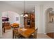 Open dining area with a wooden table and kitchen views at 5521 Hogan Ln, Winter Haven, FL 33884