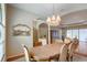 Bright dining room with a table, chairs, and a large window at 5521 Hogan Ln, Winter Haven, FL 33884
