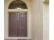 Double front doors with arched window, welcoming entryway at 5521 Hogan Ln, Winter Haven, FL 33884