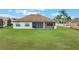 Single-story home with screened patio at 5521 Hogan Ln, Winter Haven, FL 33884