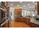 Modern kitchen with granite countertops and wooden cabinetry at 5521 Hogan Ln, Winter Haven, FL 33884