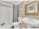 Updated bathroom with pedestal sink, shower, and glass shelving at 570 Orange Dr # 54, Altamonte Springs, FL 32701