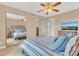 Bedroom with mirrored closets and large TV at 570 Orange Dr # 54, Altamonte Springs, FL 32701