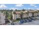 Condo building with parking lot and palm trees at 570 Orange Dr # 54, Altamonte Springs, FL 32701