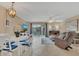 Bright living room with tile floors, comfy seating, and dining area at 570 Orange Dr # 54, Altamonte Springs, FL 32701