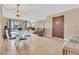 Open living and dining area with tile floors and access to balcony at 570 Orange Dr # 54, Altamonte Springs, FL 32701