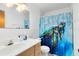 Simple bathroom with a tub shower and storage at 719 Dawson Ave, Orlando, FL 32825
