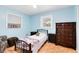 Cozy bedroom with twin bed, dresser, and window at 719 Dawson Ave, Orlando, FL 32825