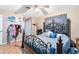 Bright bedroom featuring a comfortable bed and ceiling fan at 719 Dawson Ave, Orlando, FL 32825