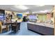 Large game room with seating and dining areas at 719 Dawson Ave, Orlando, FL 32825