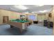Game room with pool table and seating area at 719 Dawson Ave, Orlando, FL 32825