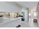 Eat-in kitchen with white cabinetry and tile floor at 719 Dawson Ave, Orlando, FL 32825