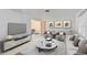 Elegant living room with stylish furnishings and a large TV at 719 Dawson Ave, Orlando, FL 32825