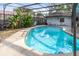 Inviting kidney-shaped pool with screened enclosure at 719 Dawson Ave, Orlando, FL 32825