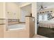 Spa-like bathroom with corner tub, walk-in shower, and granite vanity at 7703 Heritage Crossing Way # 302, Reunion, FL 34747