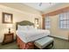 King-size bed in spacious bedroom with light walls and neutral decor at 7703 Heritage Crossing Way # 302, Reunion, FL 34747