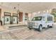Elegant building entrance with shuttle and grand entryway at 7703 Heritage Crossing Way # 302, Reunion, FL 34747