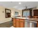 Kitchen with island, stainless steel appliances, and granite countertops at 7703 Heritage Crossing Way # 302, Reunion, FL 34747