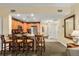 Open kitchen with breakfast bar and stainless steel appliances at 7703 Heritage Crossing Way # 302, Reunion, FL 34747