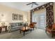 Relaxing living room with comfortable seating, a coffee table, and access to a patio at 7703 Heritage Crossing Way # 302, Reunion, FL 34747