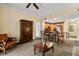 Bright living room with hardwood floors, comfortable seating, and a built-in cabinet at 7703 Heritage Crossing Way # 302, Reunion, FL 34747