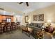 Spacious living room featuring a sofa, coffee table, and access to a balcony at 7703 Heritage Crossing Way # 302, Reunion, FL 34747