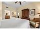 King-size bed with en-suite bathroom and walk-in closet at 7703 Heritage Crossing Way # 302, Reunion, FL 34747