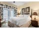 King-size bed, dresser, and access to a private balcony at 7703 Heritage Crossing Way # 302, Reunion, FL 34747