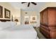 King-size bed, en-suite bathroom, and views of the surrounding area at 7703 Heritage Crossing Way # 302, Reunion, FL 34747