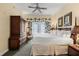 King-size bed, large armoire, and access to a private patio at 7703 Heritage Crossing Way # 302, Reunion, FL 34747