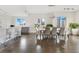 Elegant dining area, hardwood floors, and city views at 100 S Eola Dr # 1201, Orlando, FL 32801