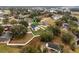 Spacious property featuring a well-kept lawn, mature trees, and a fenced yard, offering privacy and outdoor enjoyment at 10339 Castillo Ct, Clermont, FL 34711