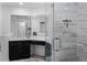 Bright bathroom with a glass shower enclosure, vanity with sink, and modern design at 10339 Castillo Ct, Clermont, FL 34711