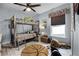 Playful bedroom with a bunk bed, basketball rug, and ample space for activities at 10339 Castillo Ct, Clermont, FL 34711