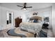 Bright bedroom with a large bed, dresser, and en-suite bathroom access at 10339 Castillo Ct, Clermont, FL 34711