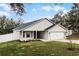 Attractive single-story home with a well-maintained lawn, an attractive neutral exterior, and a two-car garage at 10339 Castillo Ct, Clermont, FL 34711