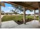 View from the front porch showing the meticulously landscaped yard and the friendly neighborhood at 10339 Castillo Ct, Clermont, FL 34711