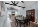 Spacious living room featuring an elegant dining space with a fireplace and a large television at 10339 Castillo Ct, Clermont, FL 34711