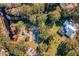 Aerial view showcasing the home's location near a tennis court and waterways at 11036 Schooner Way, Windermere, FL 34786