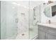 Clean, modern bathroom featuring a spacious glass-enclosed shower and elegant vanity at 11036 Schooner Way, Windermere, FL 34786