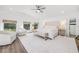Spacious main bedroom features a vaulted ceiling, plush furniture, and an attached closet at 11036 Schooner Way, Windermere, FL 34786