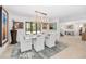 Dining room with modern chandelier and views to the entry and kitchen at 11036 Schooner Way, Windermere, FL 34786