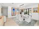 Bright dining area with modern chandelier, neutral decor, and views to the exterior at 11036 Schooner Way, Windermere, FL 34786