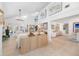 Open-concept living room with views to the dining area, featuring high ceilings and art at 11036 Schooner Way, Windermere, FL 34786