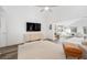 Cozy living room featuring a TV, modern decor, and an open layout leading to other living spaces at 11036 Schooner Way, Windermere, FL 34786