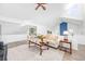 Bright living room with vaulted ceiling, modern furniture, and hardwood floors for a luxurious feel at 11036 Schooner Way, Windermere, FL 34786