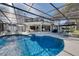 Sparkling pool with an enclosed screened lanai including seating and dining areas, perfect for entertaining at 11036 Schooner Way, Windermere, FL 34786