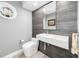 Chic powder room featuring modern fixtures, stylish sink, and accent wall for a luxurious feel at 11036 Schooner Way, Windermere, FL 34786